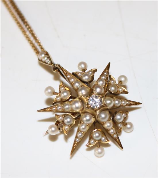 An Edwardian, gold, split pearl and diamond set starburst pendant brooch, pendant 30mm.